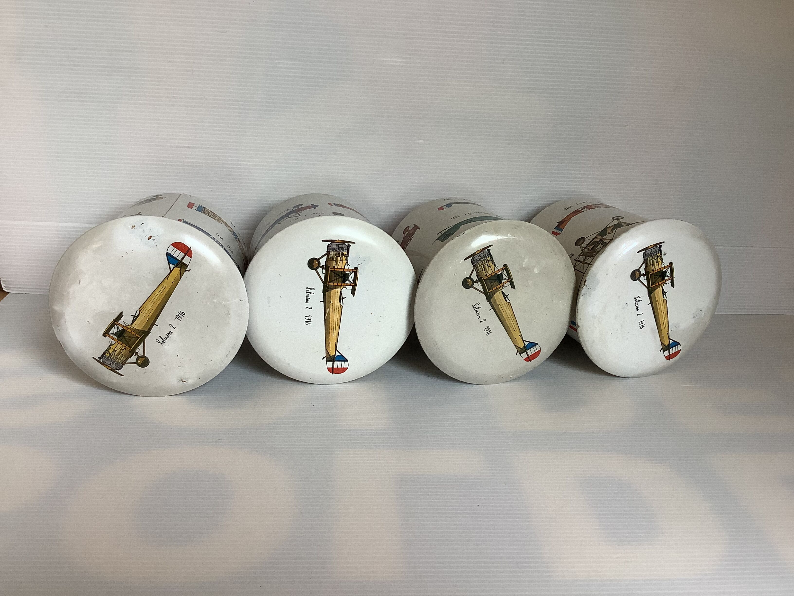 4 old metal boxes lithographed aircraft pattern