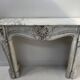 Louis XV style fireplace in veined white Carrara marble, 19th century.