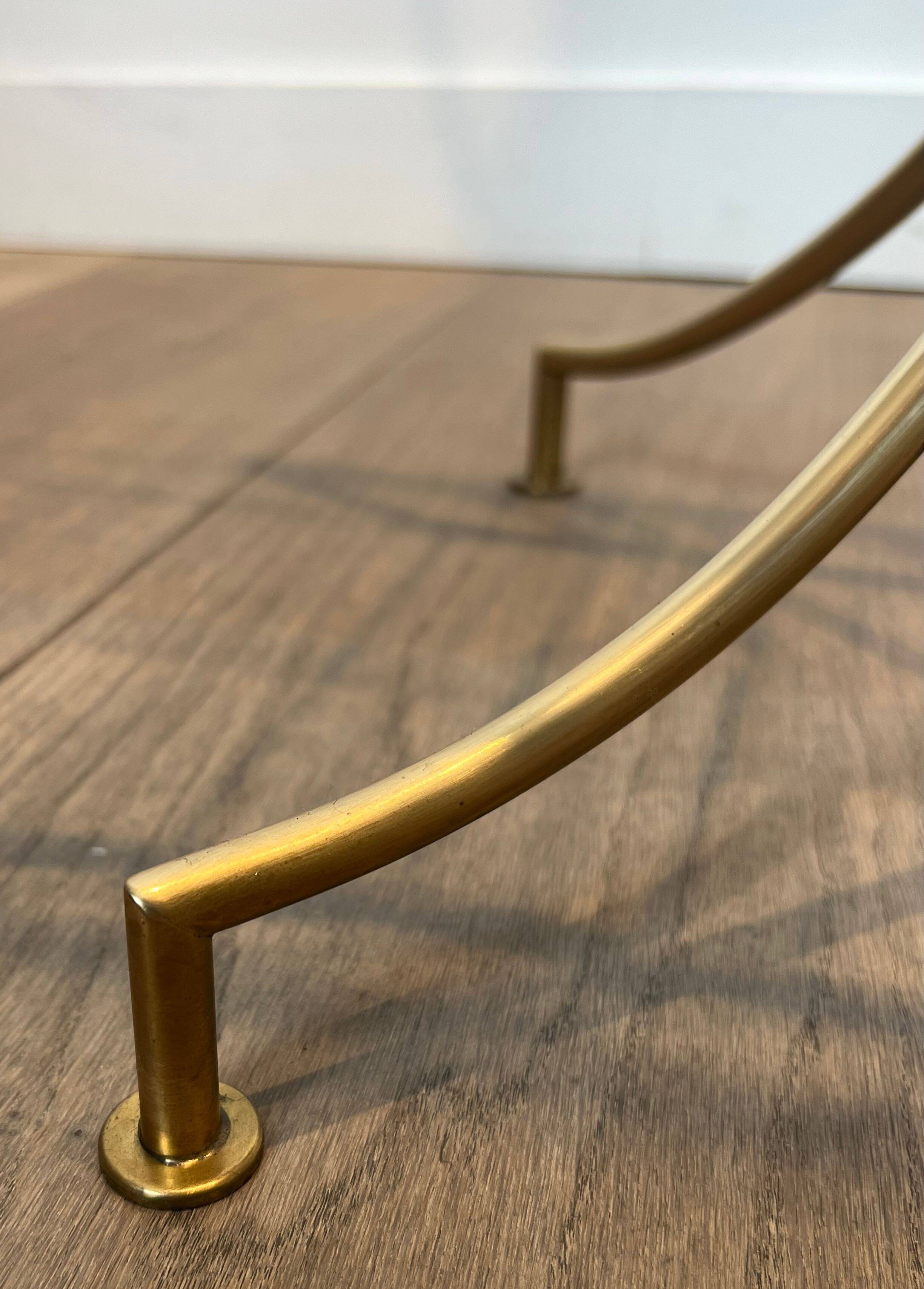 Designer floor lamp in black lacquered metal and brass, incorporating a magazine rack