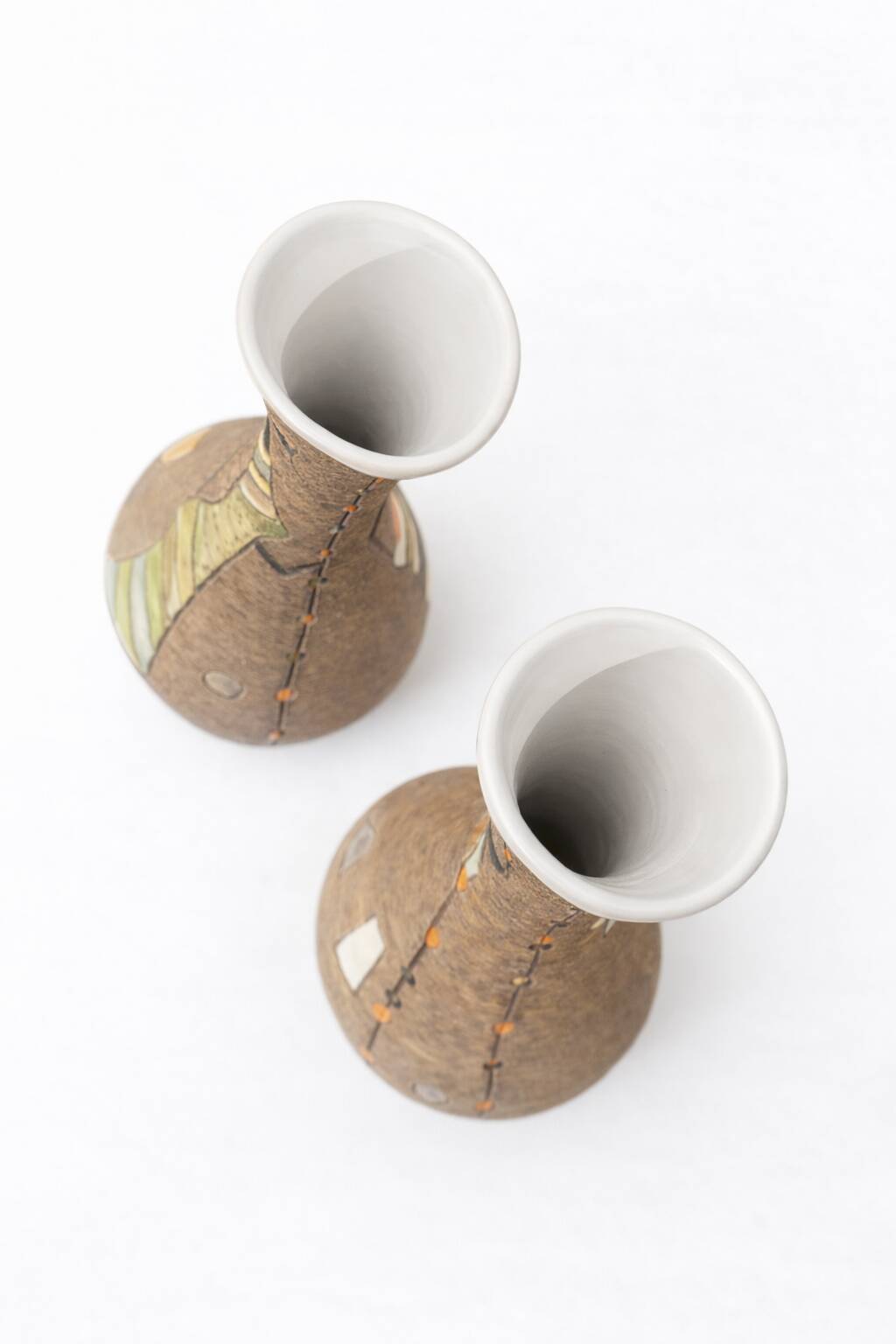 Pair of Fratelli Fanciullacci vases, sgraffito decoration with stylised figures,