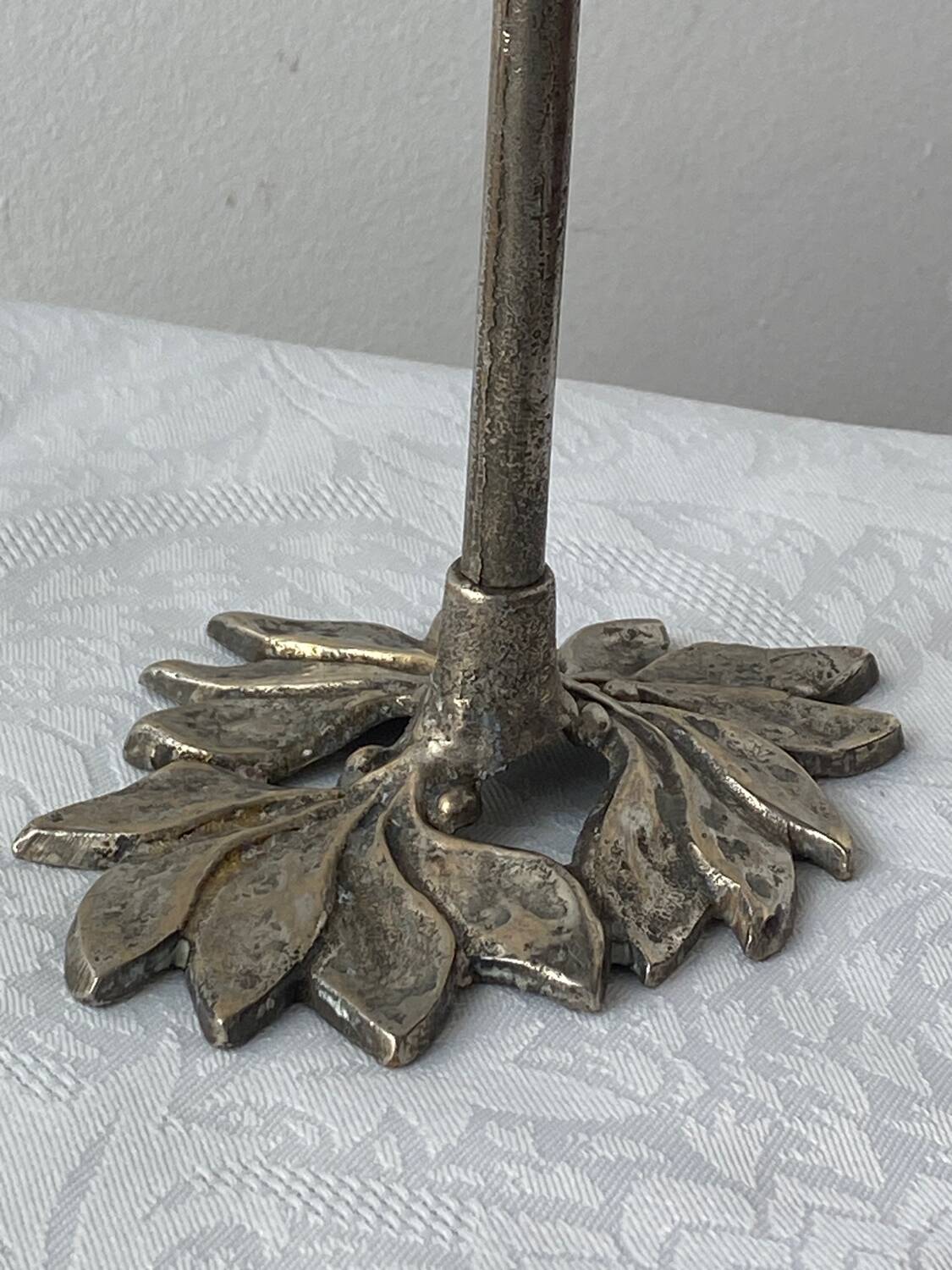 Pair of metal flower candlesticks
