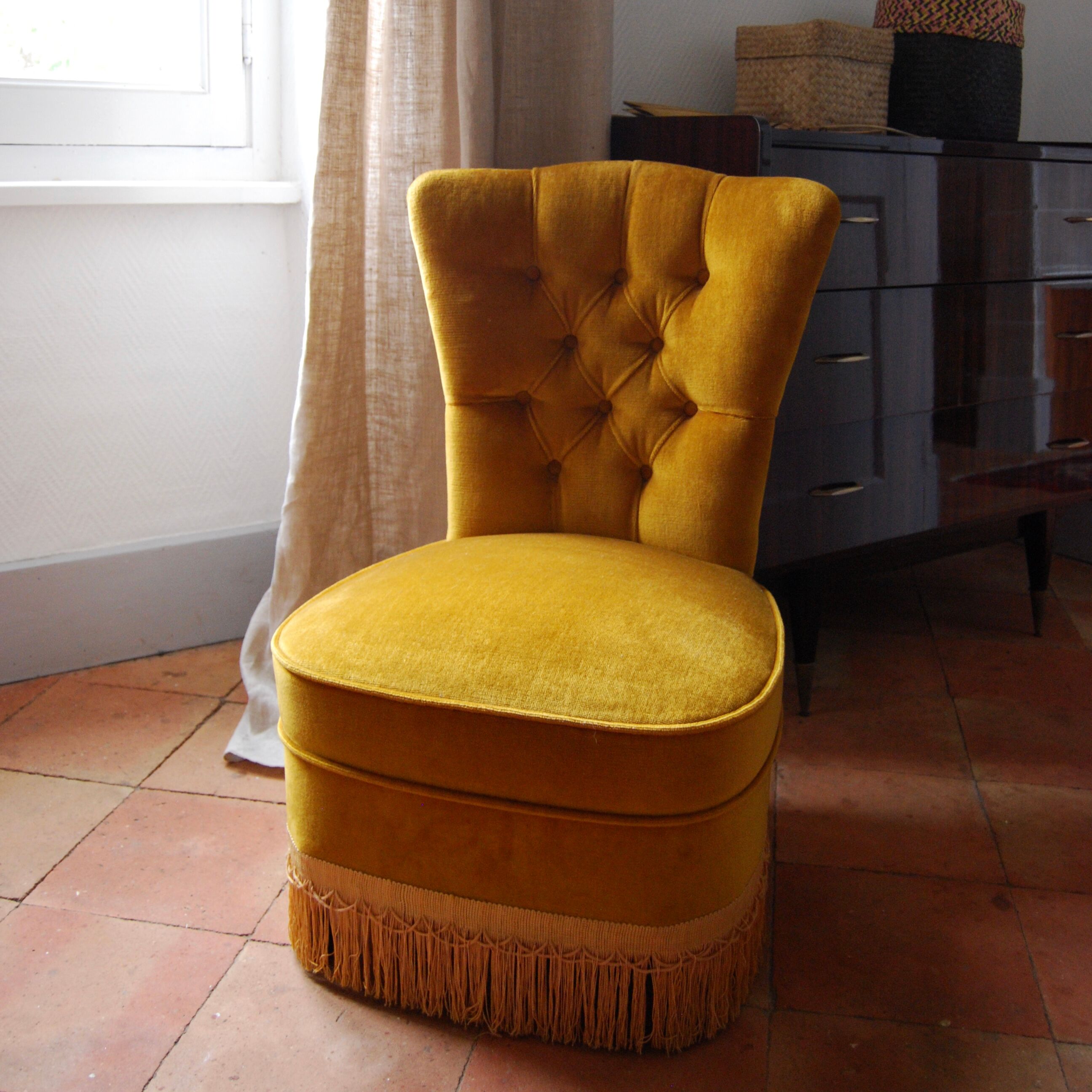 Toad in yellow velvet armchair