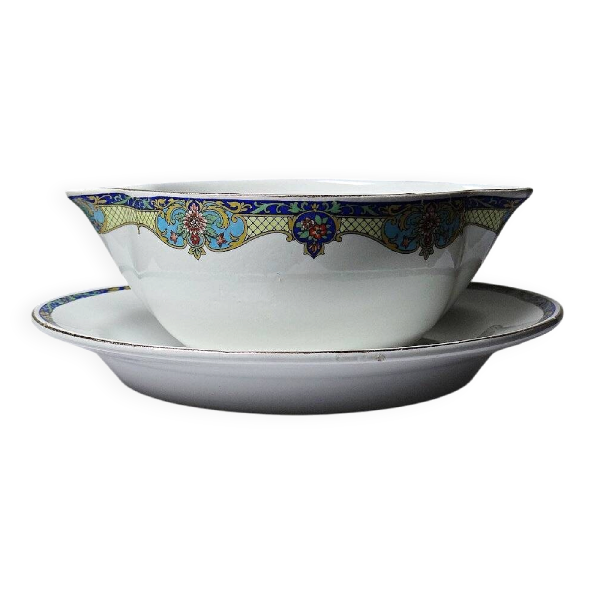 Old Lunéville sauce boat, opaque porcelain with polychrome decoration.