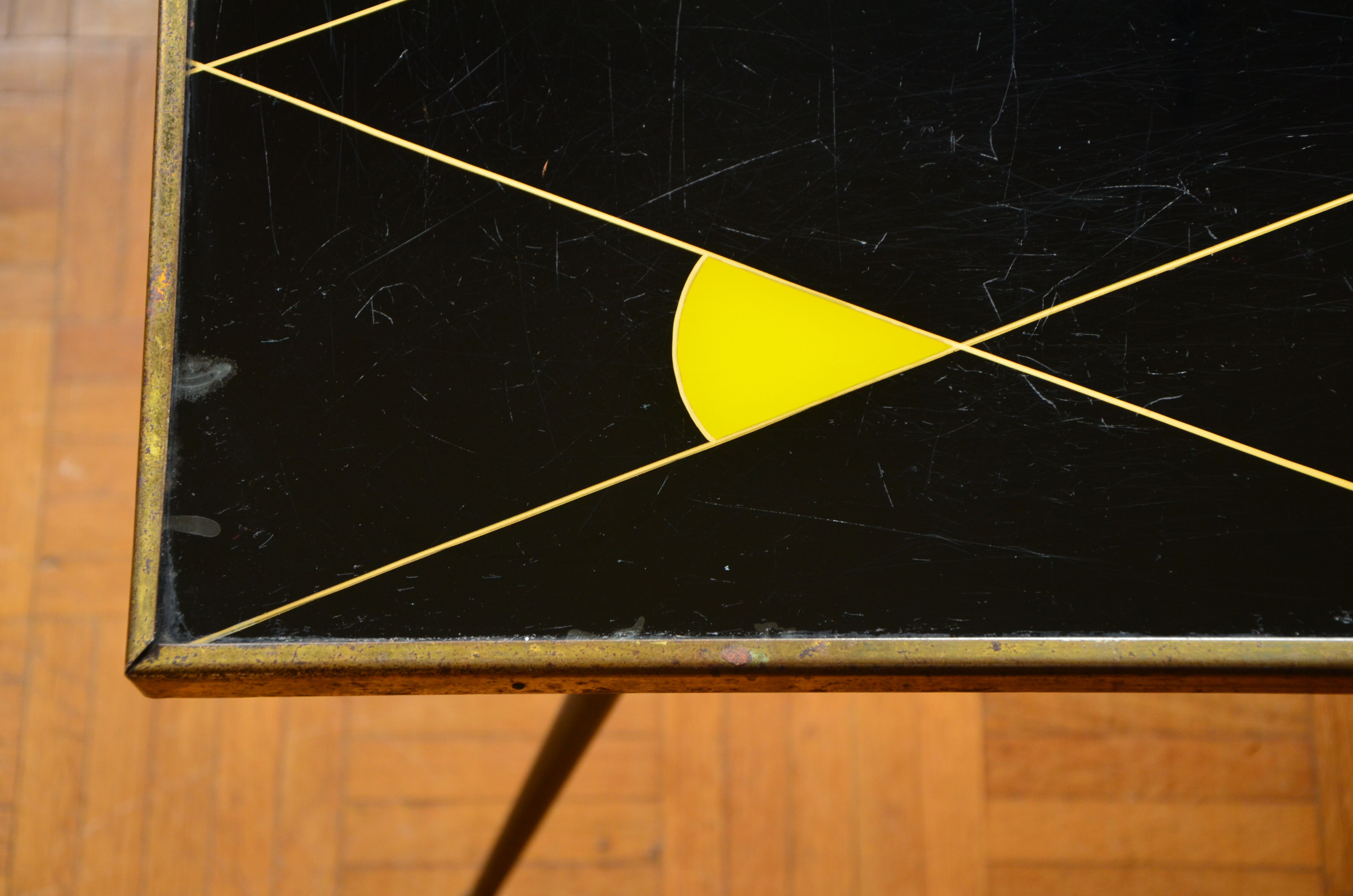 Brass and glass coffee table with compass feet