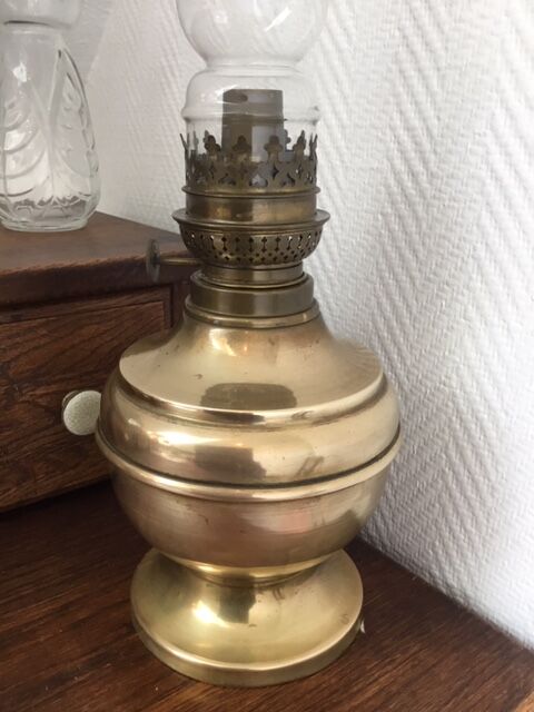 Old-fashioned brass standing oil lamp