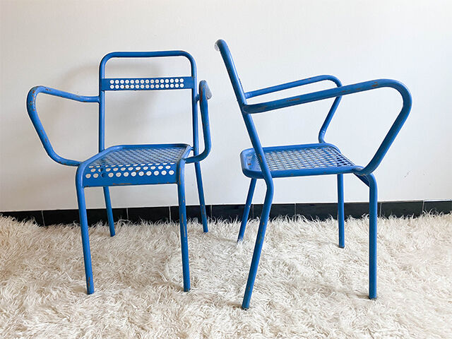 Pair of perforated metal garden chairs