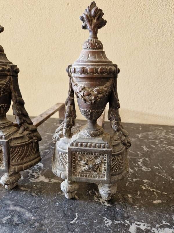 Pair of bronze andirons in Louis XVI style, late 19th century.