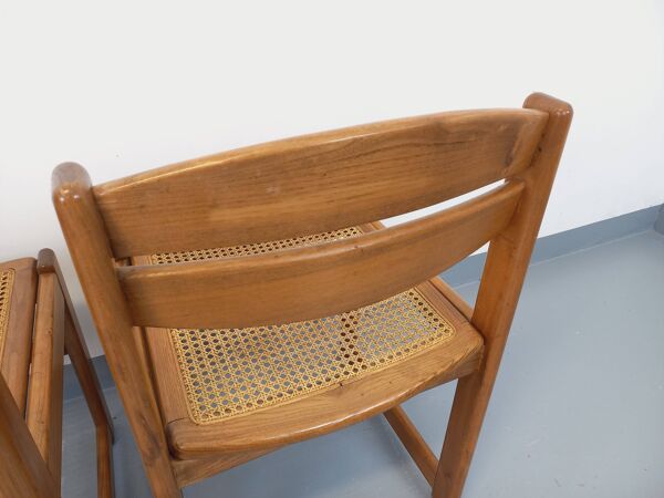Paire de chaises traîneau vintage en bois de hêtre et cannage des années 70