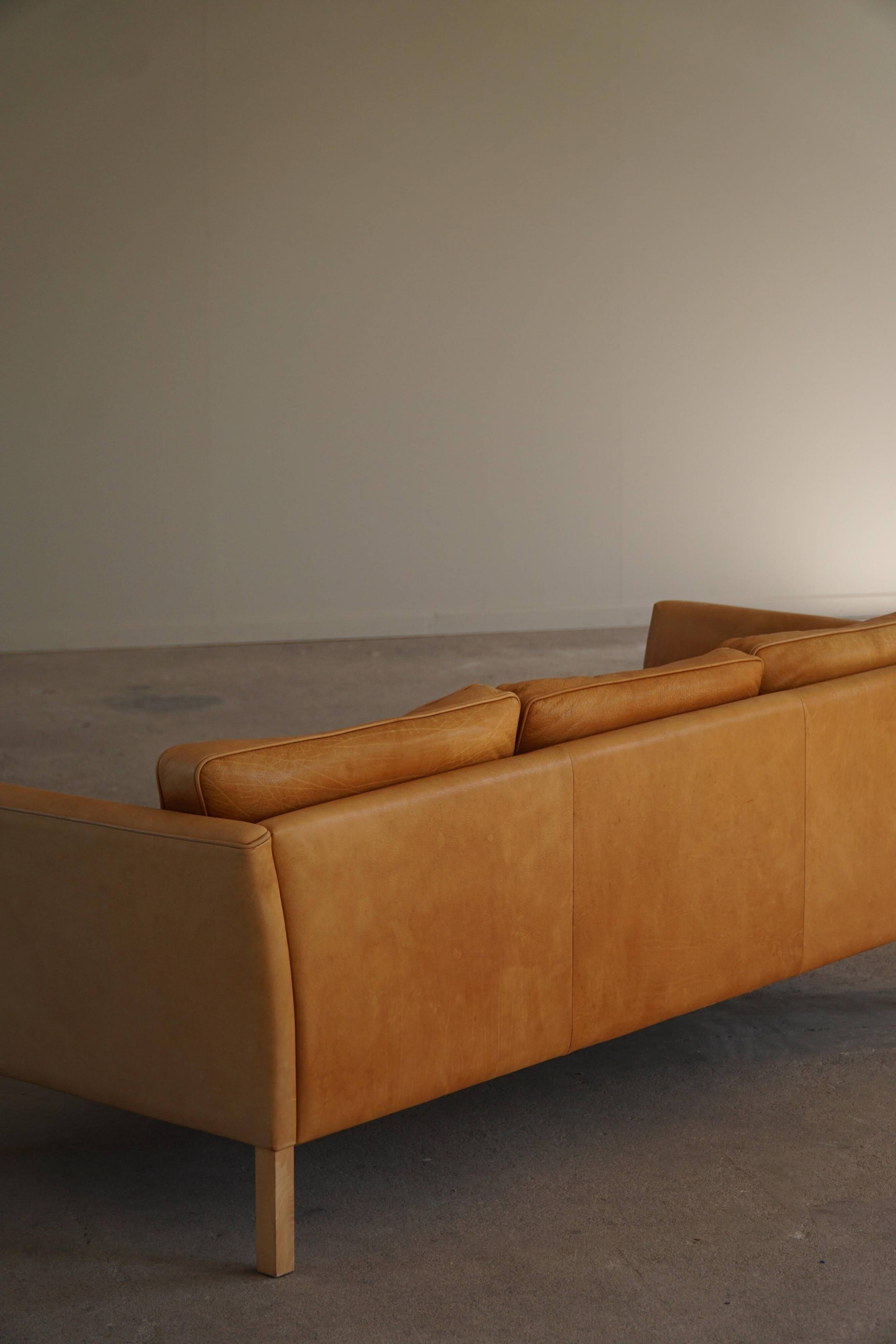 Danish Midcentury 3-seater canapé by Stouby in cognac brown leather, made in the 1970s.