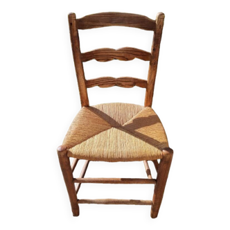 Old farm chair in wood and straw, Normandy