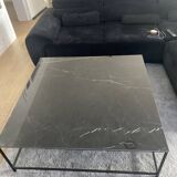 Coffee table with ceramic top and wrought iron base