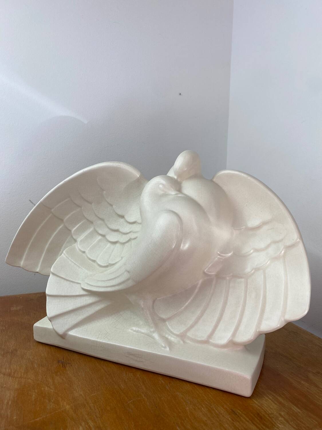 Cracked ceramic doves, signed Lejan