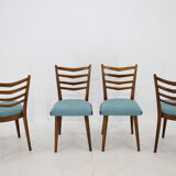 Ensemble de quatre chaises à manger années 1960.