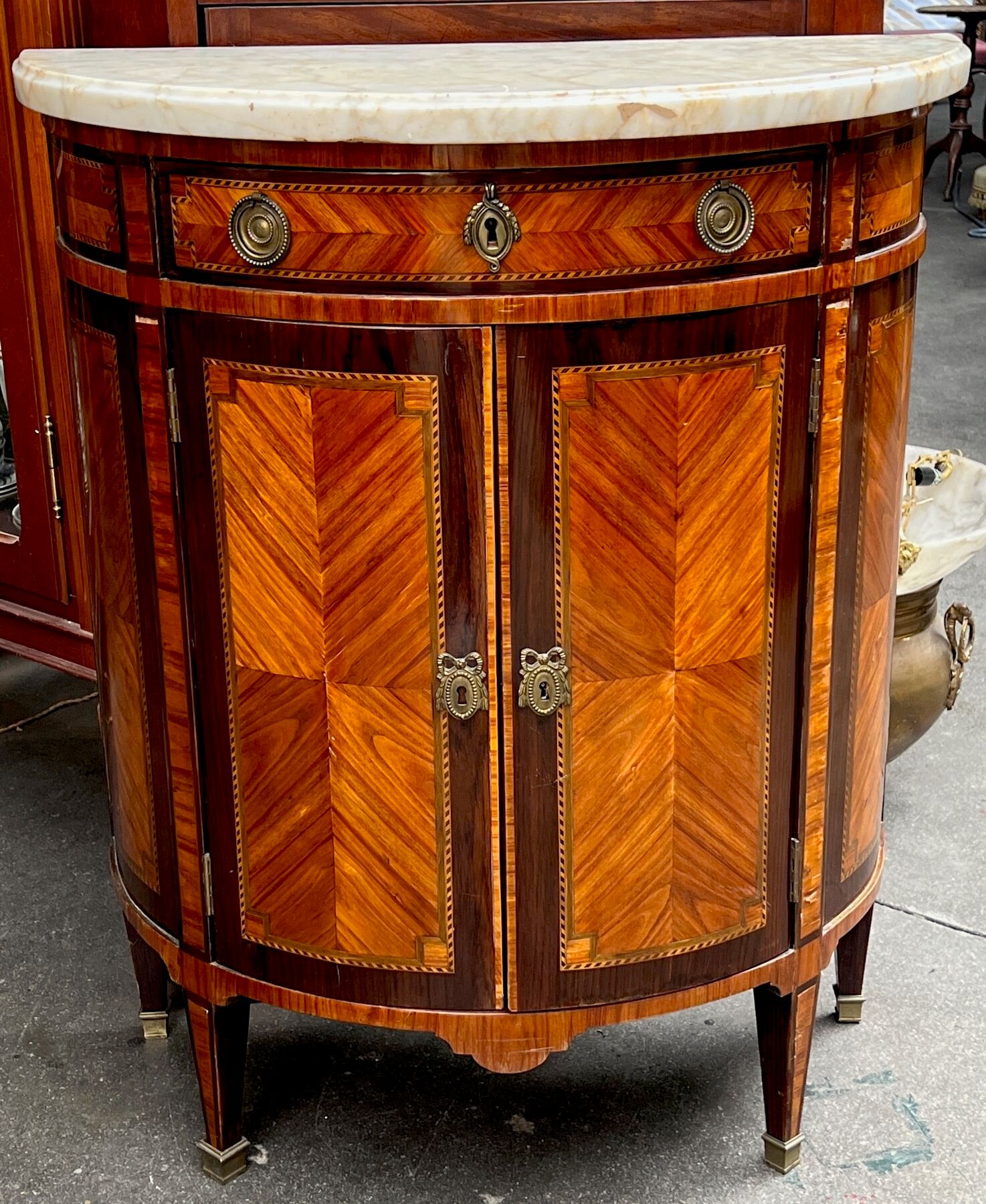 Louis XVI style chest of drawers with marquetry and marble top.