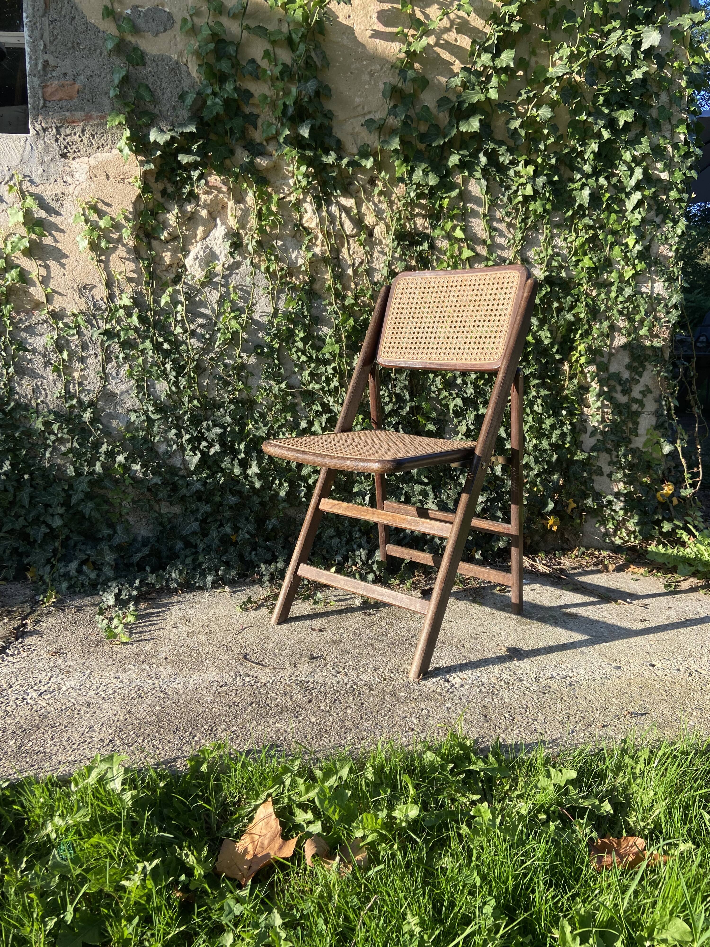 Folding chair in wood and cane.