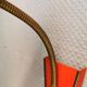 Danish red lacquered wall light with brass details. Estimated 1980s