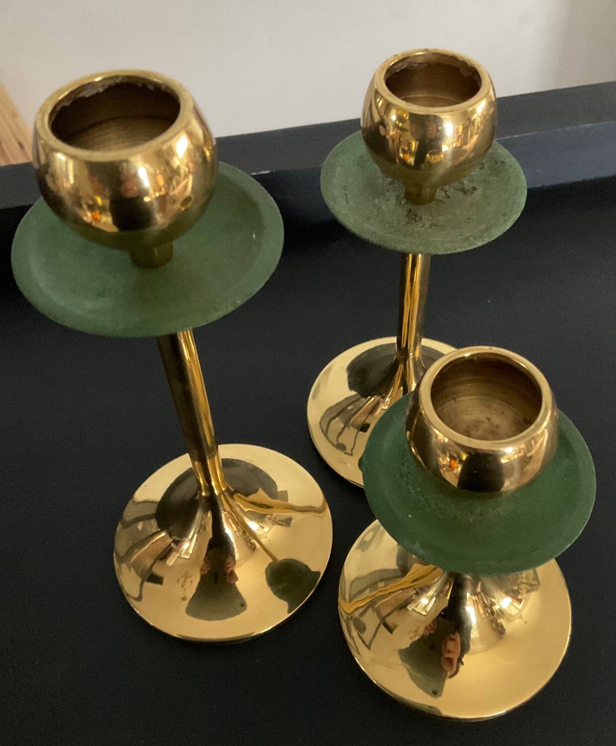 Trio of vintage brass candlesticks