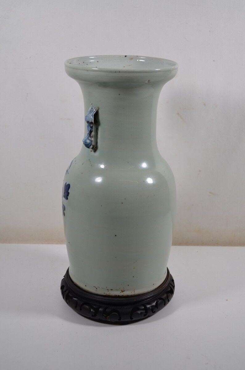 China. Porcelain mallet vase with blue and white phoenix decoration on a rock.