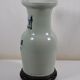 China. Porcelain mallet vase with blue and white phoenix decoration on a rock.
