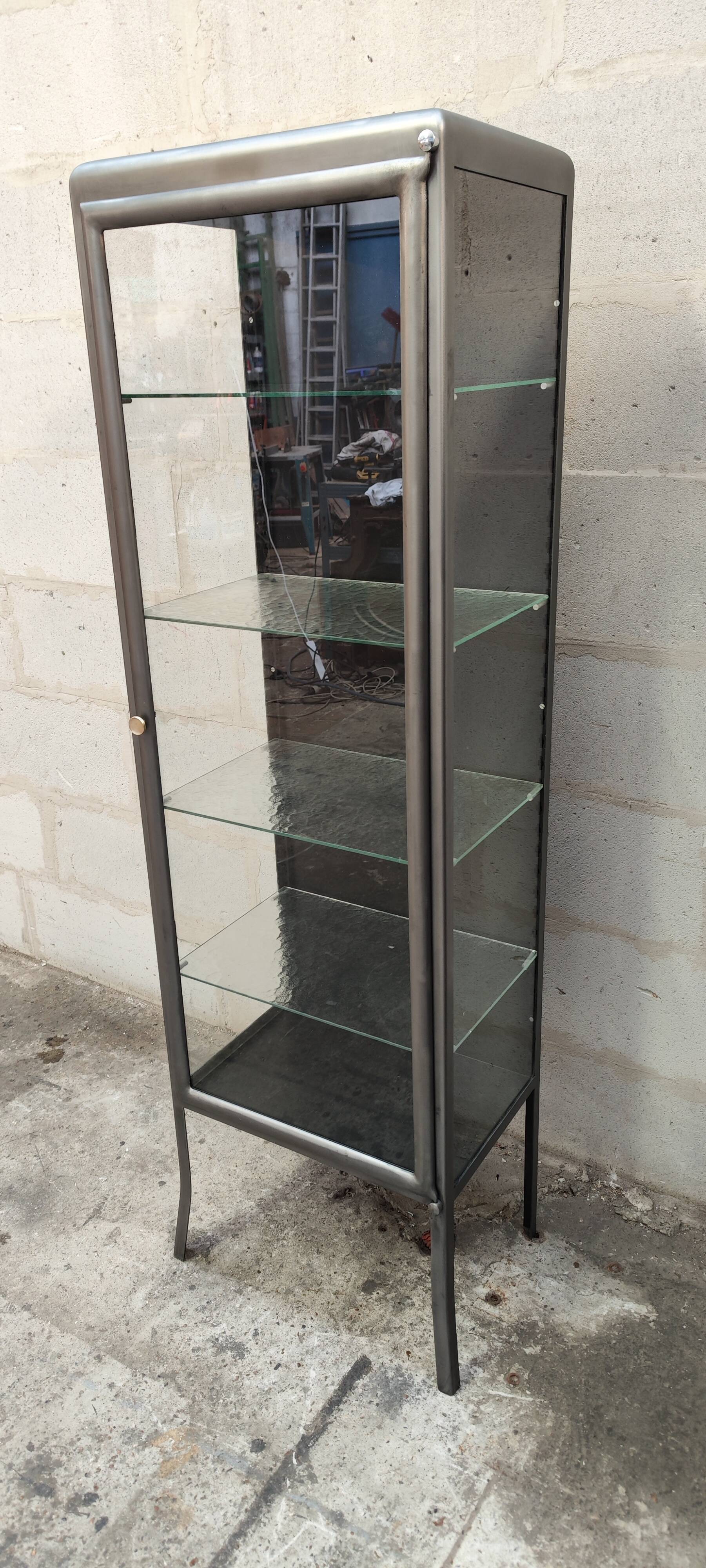 old medical display case with a graphite metal door