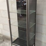 old medical display case with a graphite metal door