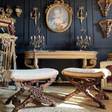 Paire de curules de la fin du xixe en bois sculpté de style Louis xv