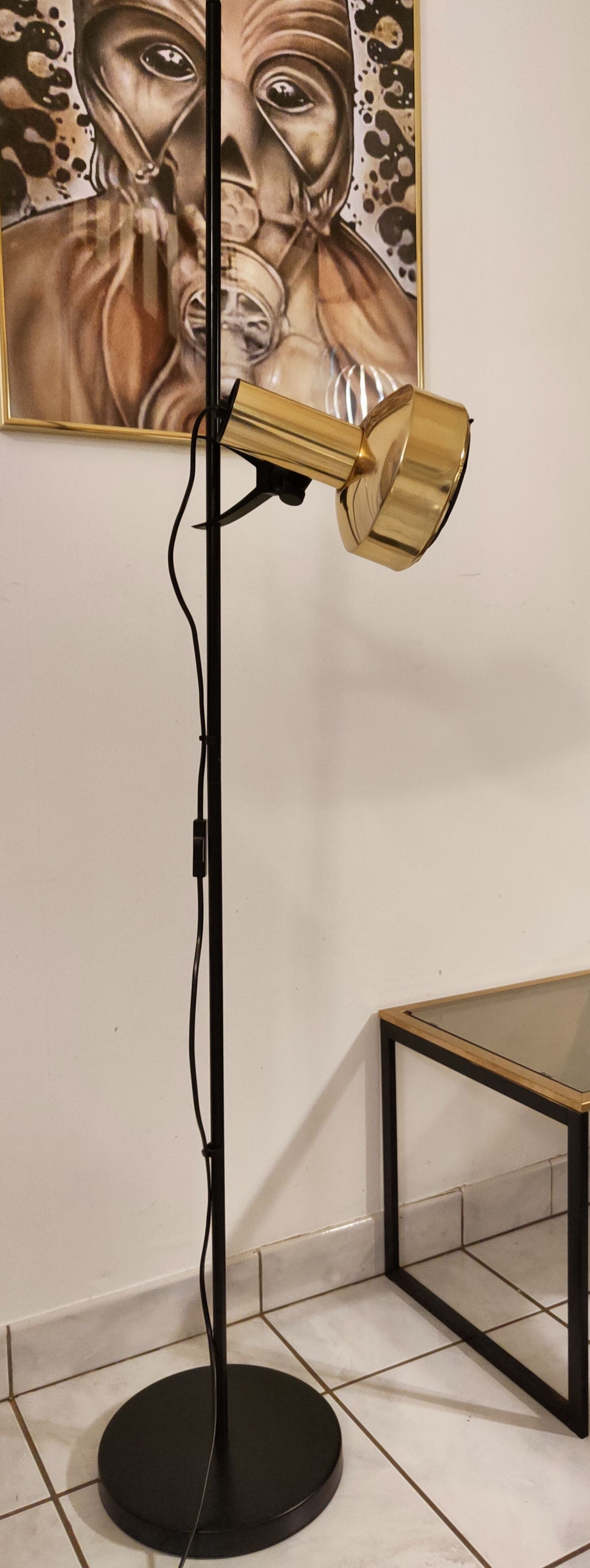 Black floor lamp is gold vintage 1980