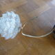 Brass wall sconce with globe in the shape of vintage 1960s flowers