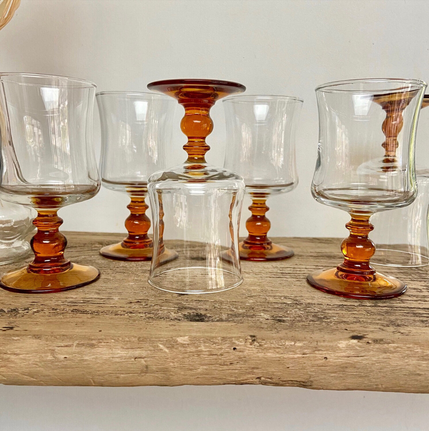 6 small amber-stemmed glasses