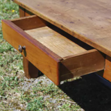Rustic old wooden coffee table with crossbeam and drawer