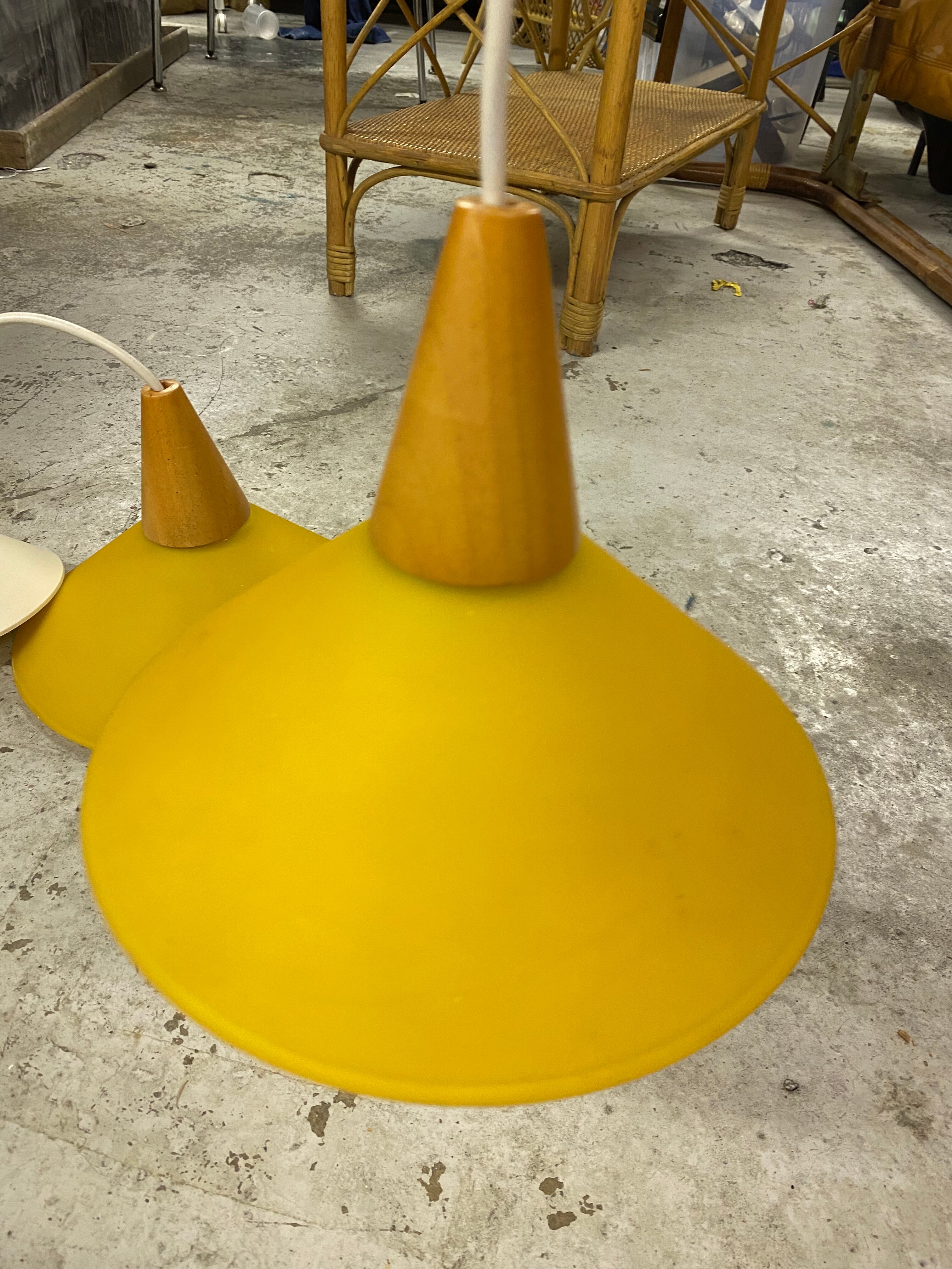 Duo of yellow glass pendant lamps