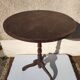Small rustic antique tripod side table made of solid wood.