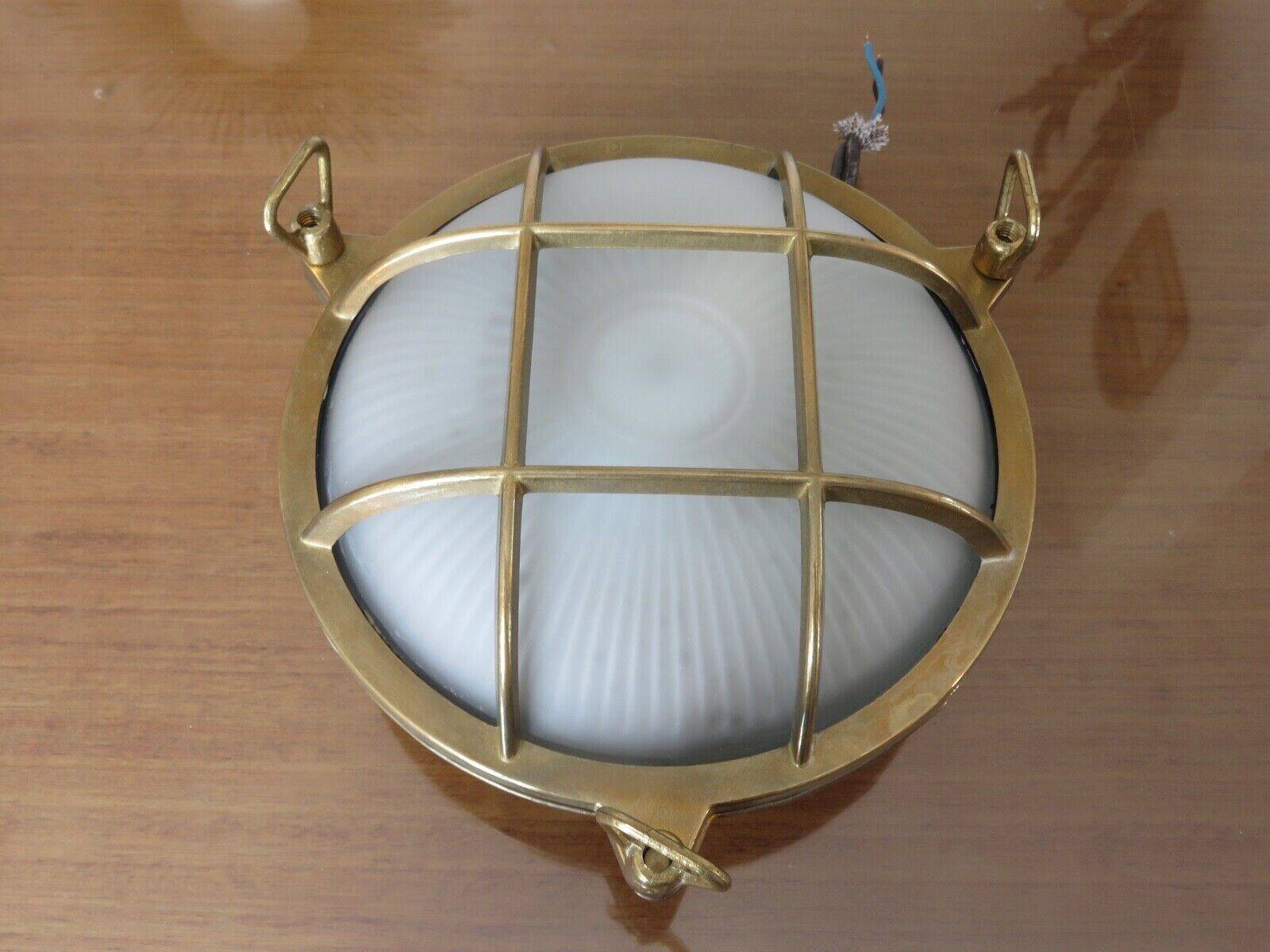 Brass porthole wall lamp