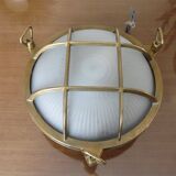 Brass porthole wall lamp
