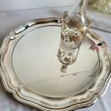 Round silver-plated serving dish with a glass base.