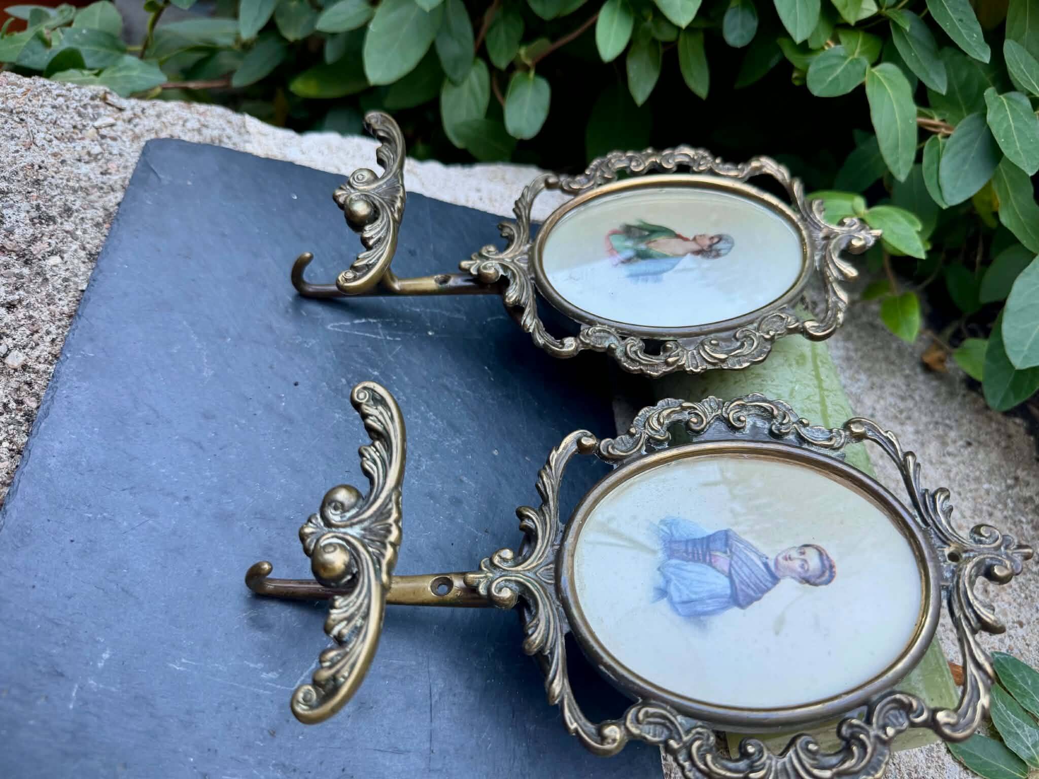 Pair of baroque brass coat hooks