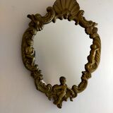 Gilded bronze mirror with angels and scrolls