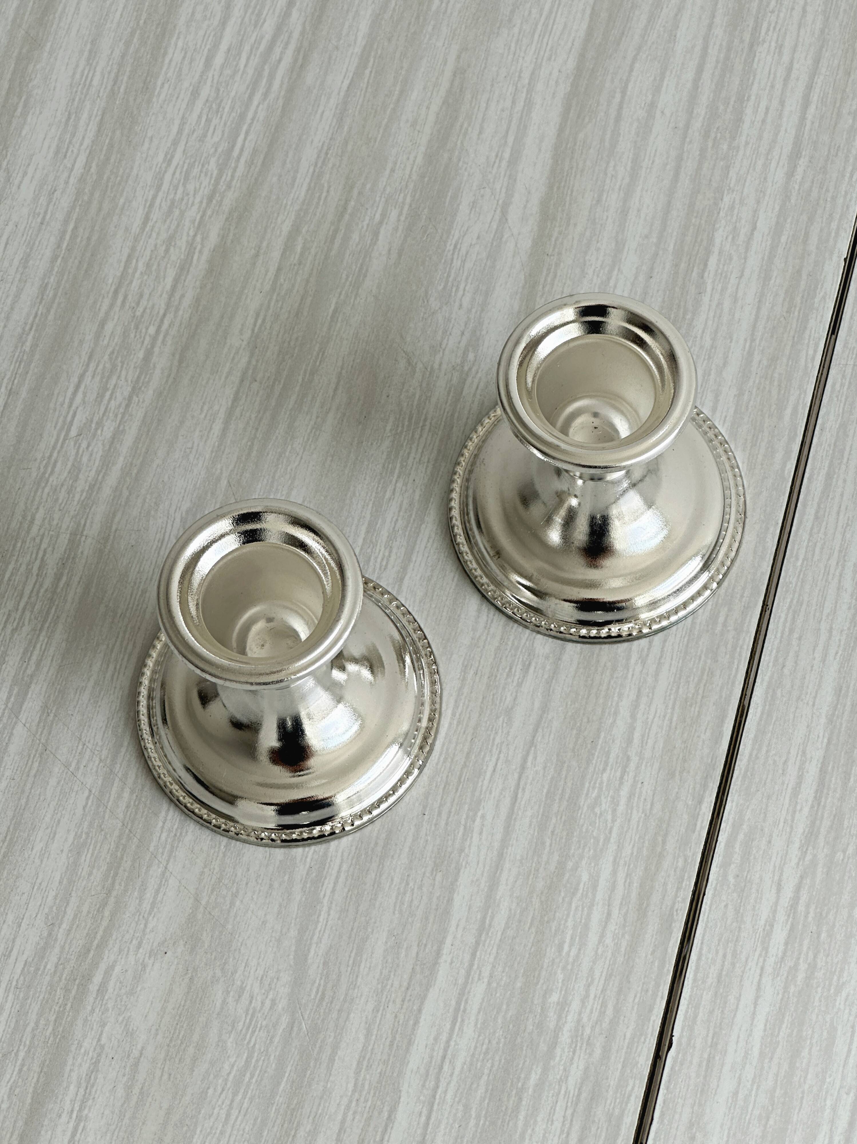 Pair of lightweight silver metal candlesticks