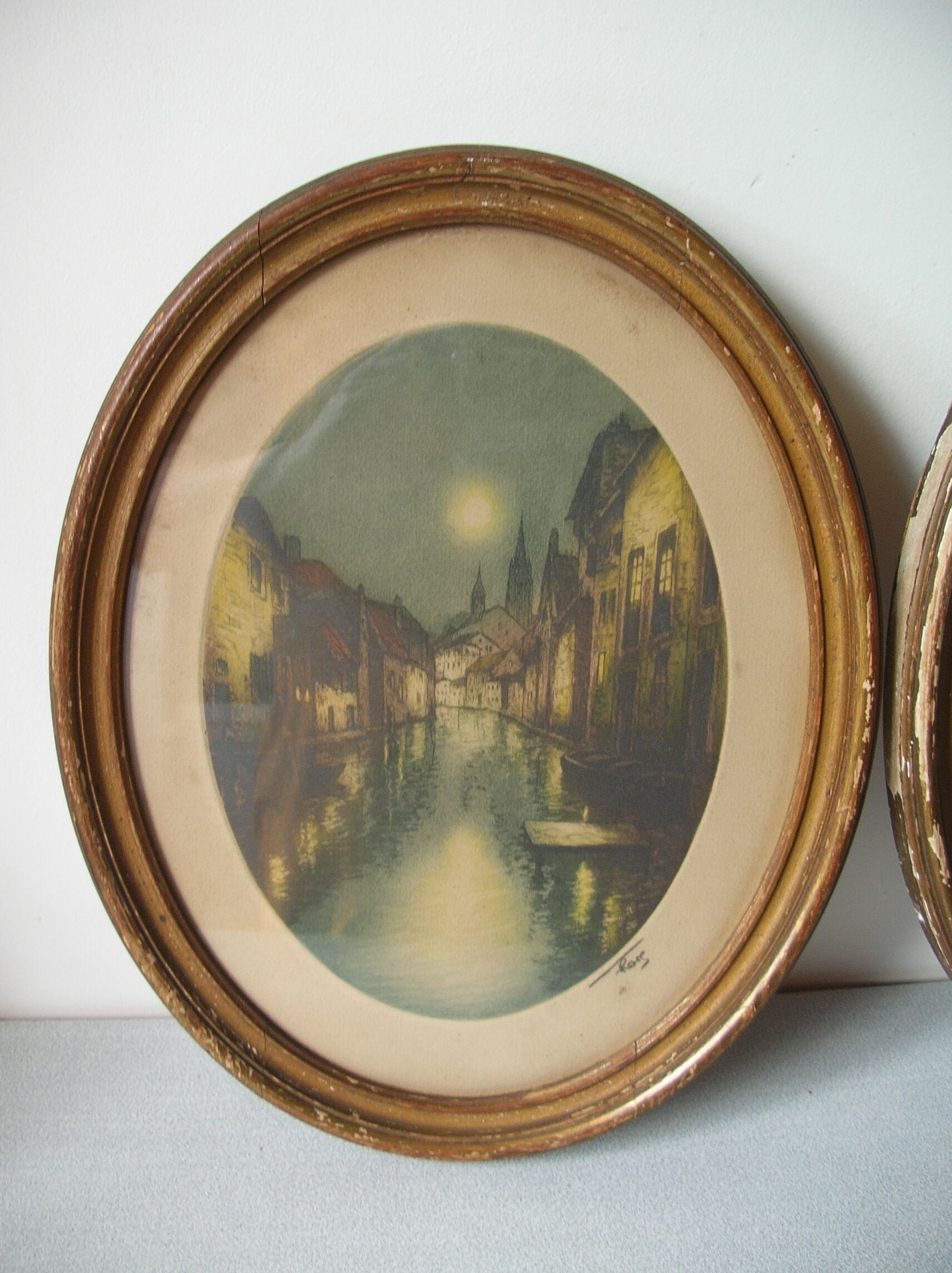 Old pair of lithographs house at the edge of the water signed wooden medallion frame
