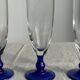 Set of 6 blue-footed champagne flutes; 3 pairs of designs.