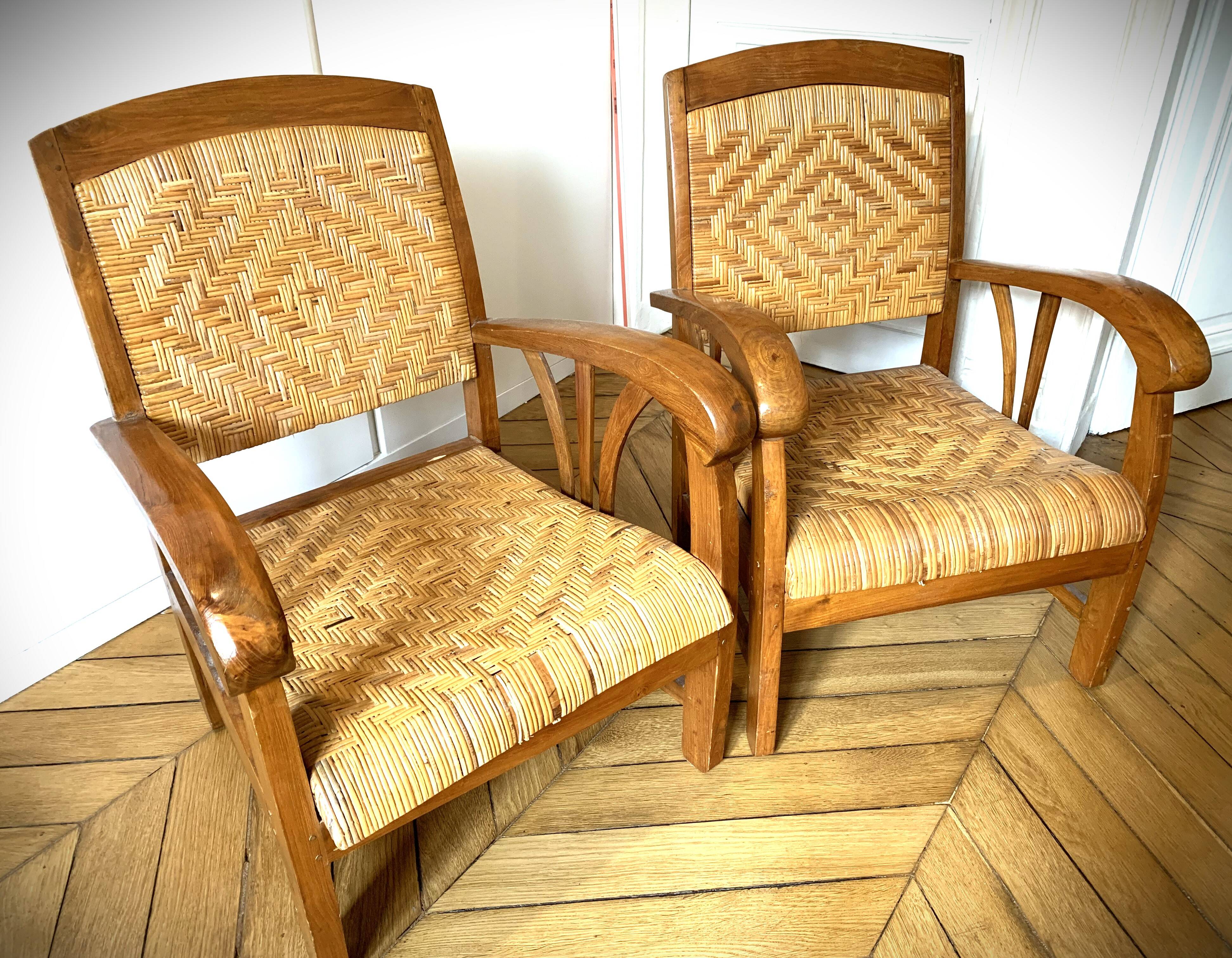 Two contemporary teak and rattan armchairs