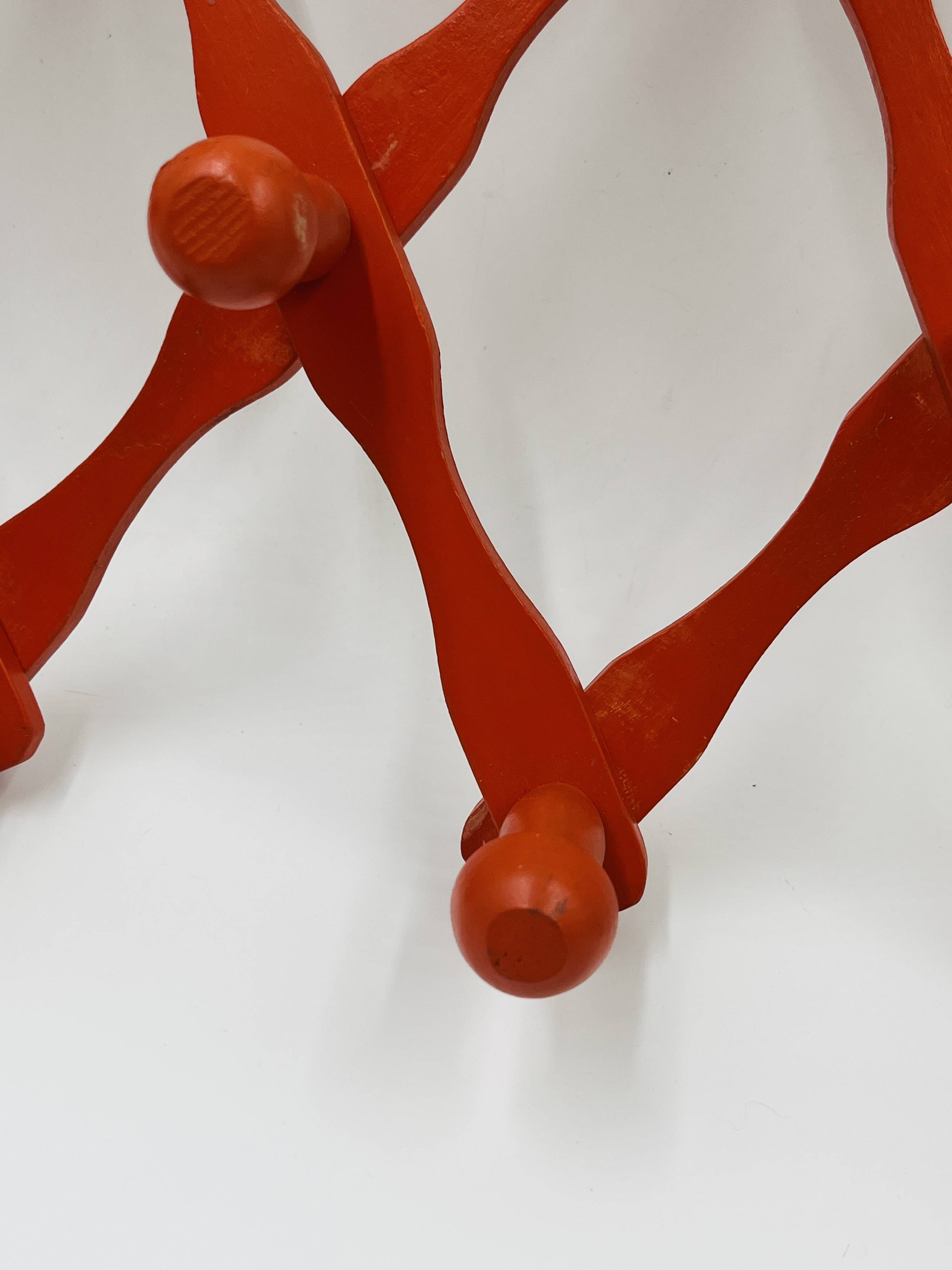 Vintage orange accordion coat rack