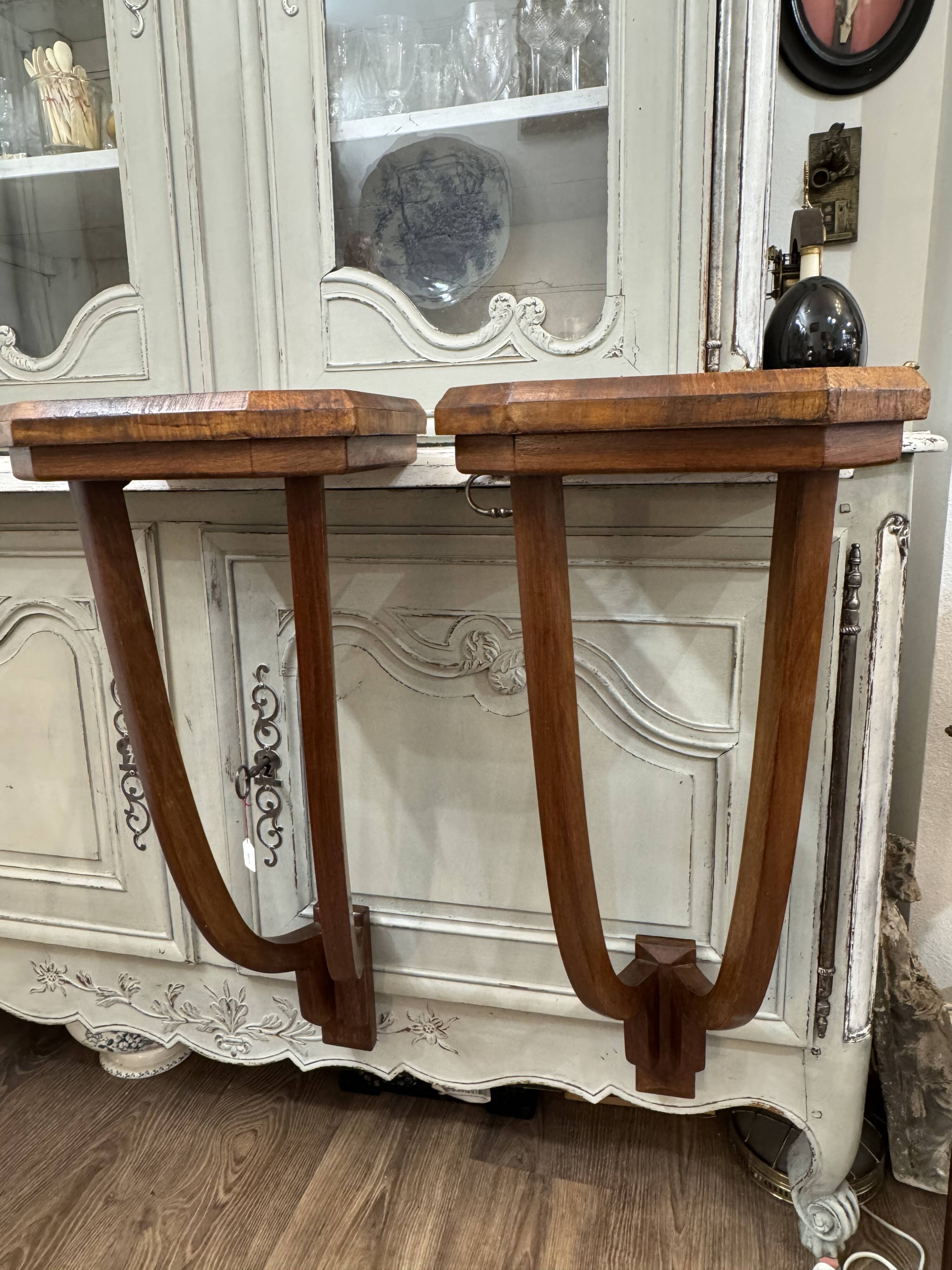 Old pair of Art Deco wall consoles from around 1930 in walnut.