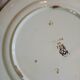 13 mismatched flat plates in ironstone