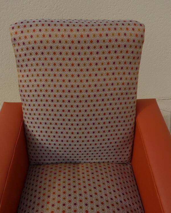 Retro vintage rockabilly armchair in orange faux leather and vintage fabrics