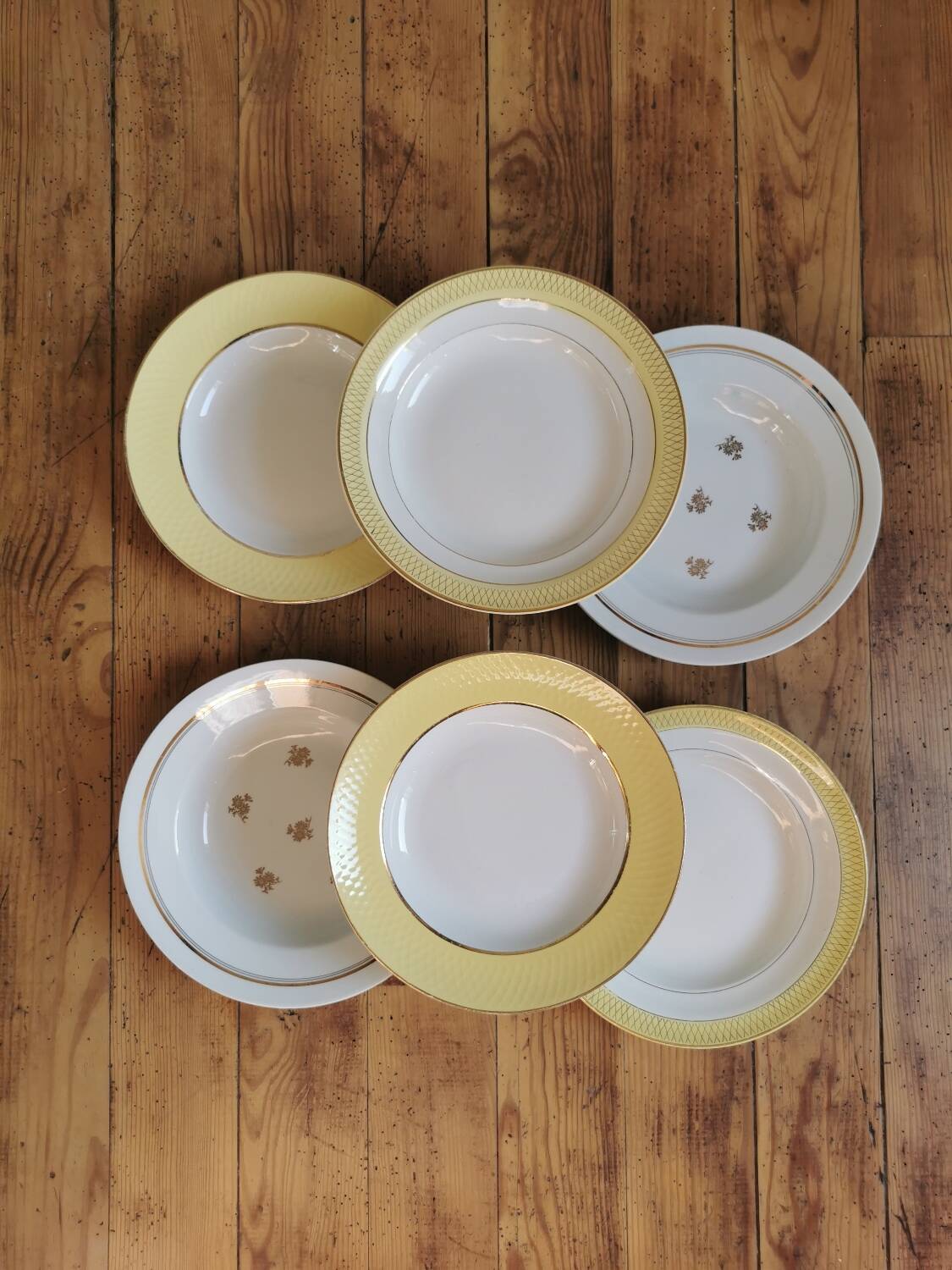Vintage mismatched yellow and gold soup plates
