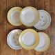 Vintage mismatched yellow and gold soup plates