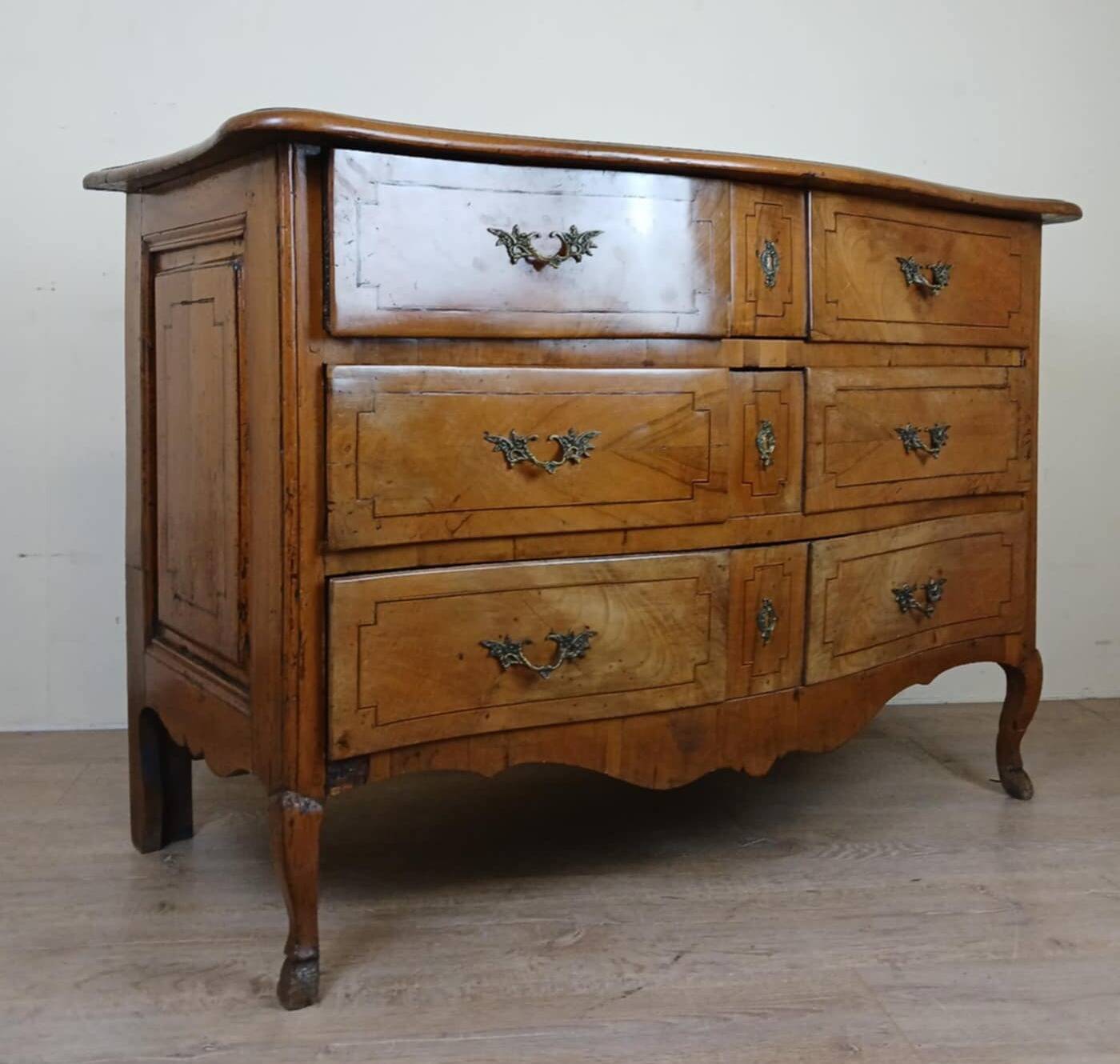 Louis XV period curved chest of drawers in elm and marquetry fillets circa 1750