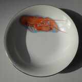 Eight hollow plates decorated with lobsters