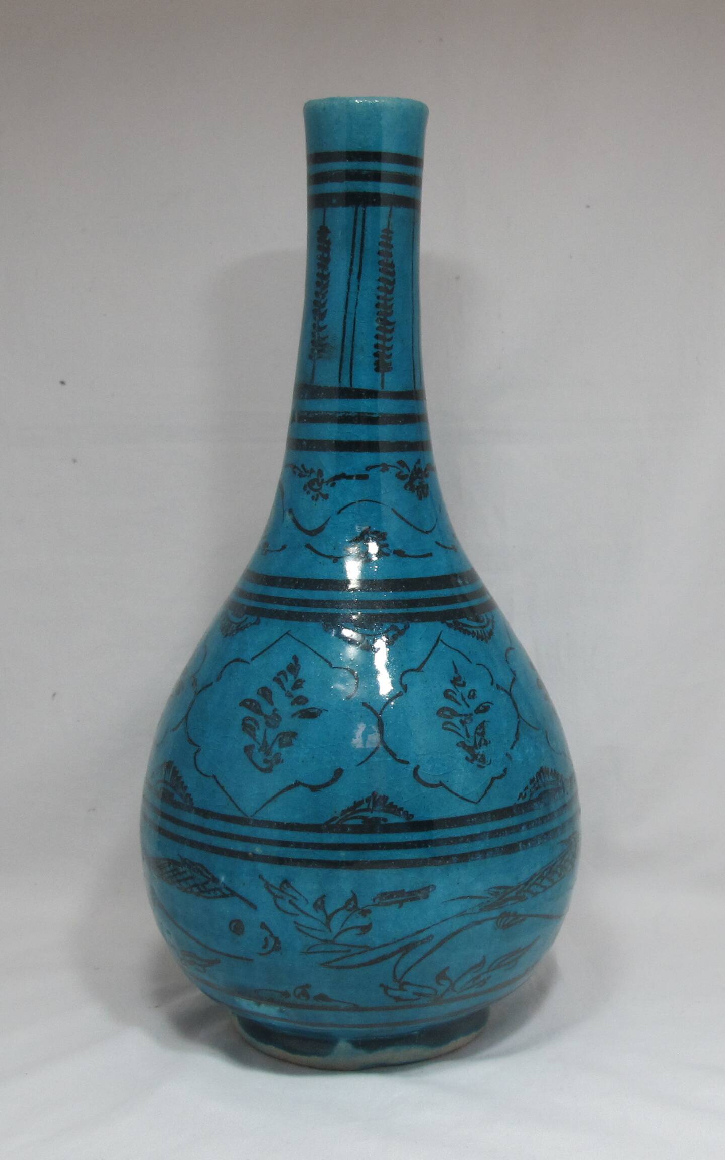 Islamic ceramic vase with turquoise background